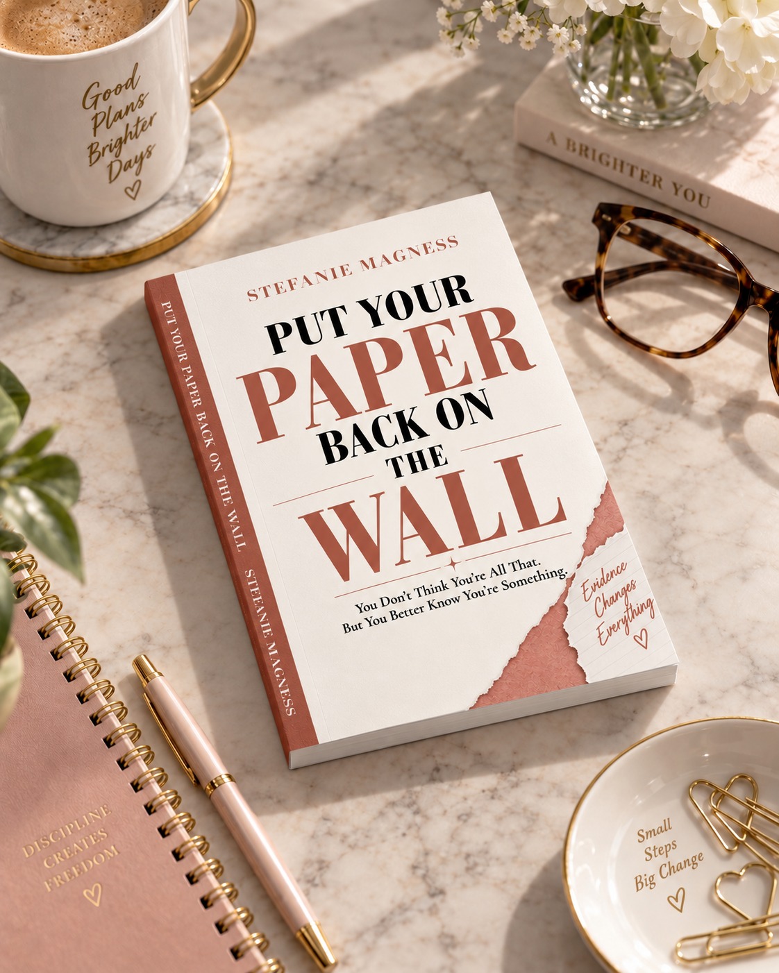 Put Your Paper Back on the Wall beside a notebook and reading glasses
